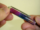 Twisting pen cap onto top tube