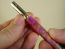 Sliding the decorative band onto the pen mechanism