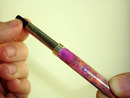 Screwing the pen refill into the pen mechanism