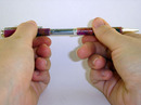 Pushing pen halves together