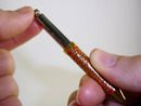 Screwing pen refill into front tube