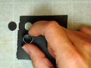 Making round eyes from black clay sheet