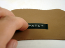 Pressing label into clay